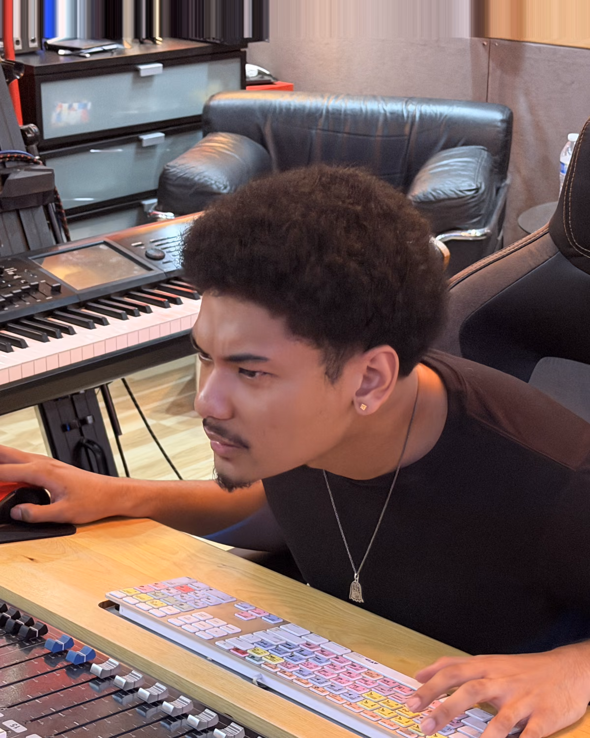 Kai McGilvery, recording engineer, mixing at the console in Sonic Studio